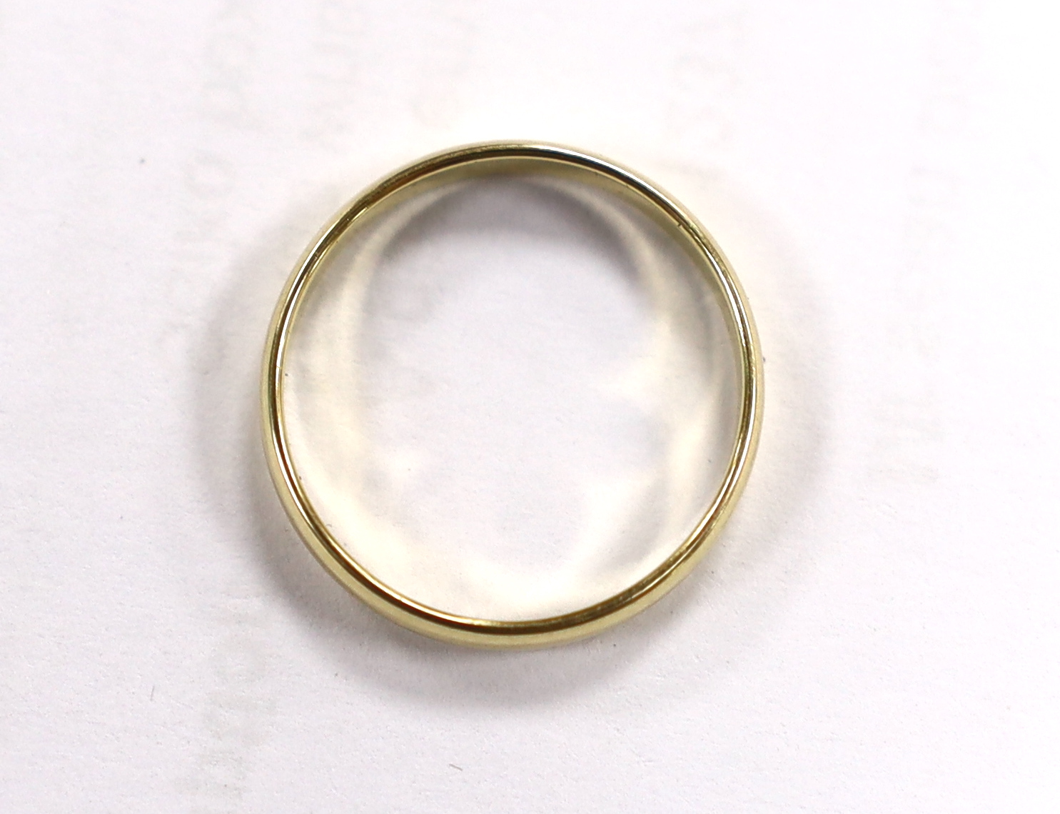 A 585 yellow metal wedding band, size M/N, 1.6 grams.